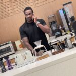 A proud student holds his certificate after a course with Authorized SCA Trainer Maryam.