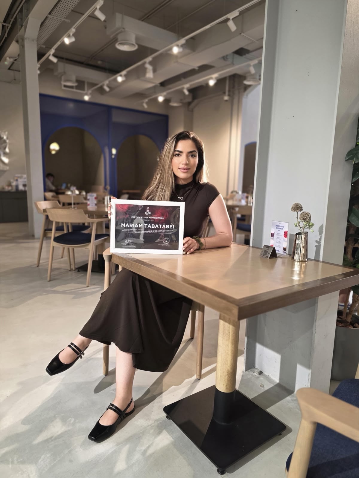 Maryam Tabatabaei with her judging participation certificate from the Refill Roastery barista competition